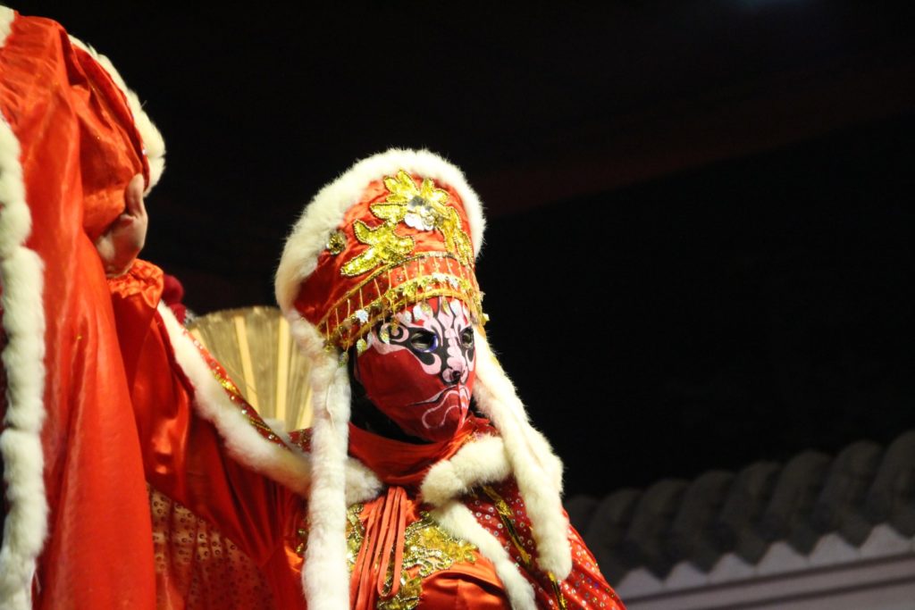This is a photo of a man wearing a red mask.