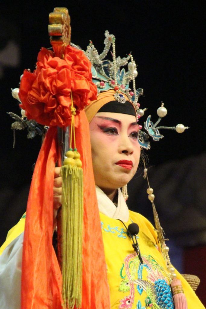 This is a photo of a women holding a stick.