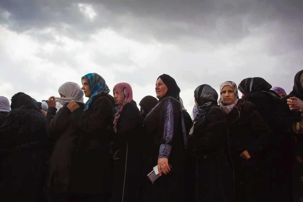 women in a line UNHCR in Lebanon