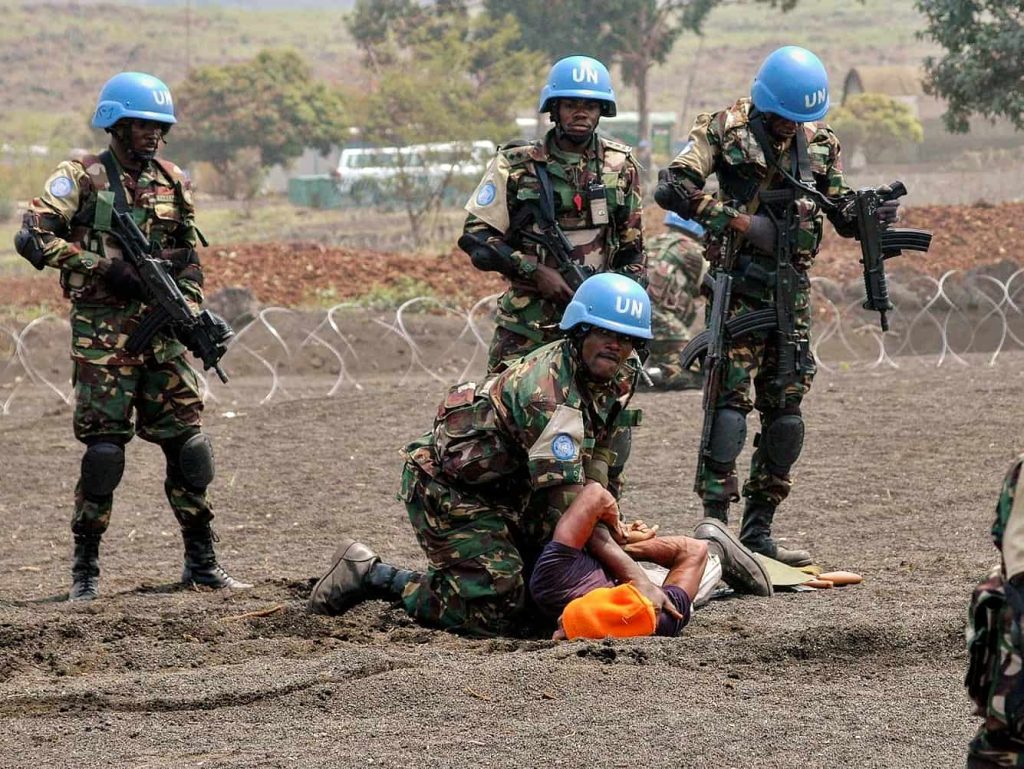 UN peacekeeping troops with arms.