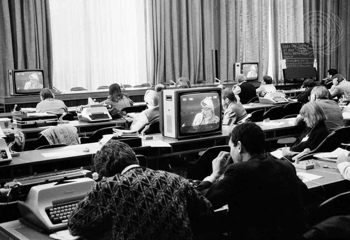 Press correspondents listening to Chairman Yasser Arafat's speech on 13 December 1988. ©UN Photo