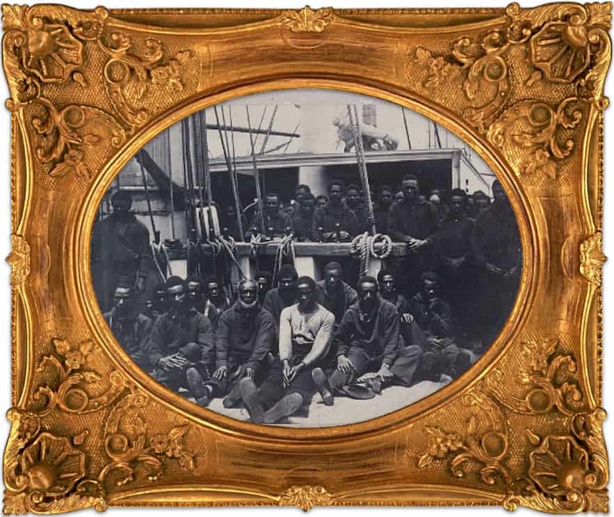 African Americans on the USS Vermont in Union-occupied South Carolina during the 1860s. No longer slaves, but not yet free, these men, women and children, known as 'contrabands,' are caught between slavery and freedom in one of the earliest photographic records of Civil War-era Black life. Photo: Henry P. Moore / Public Domain