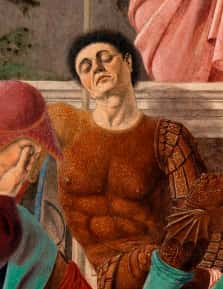 The brown-robed guard beneath Christ’s banner is thought to be Piero della Francesca—present yet oblivious to the Resurrection